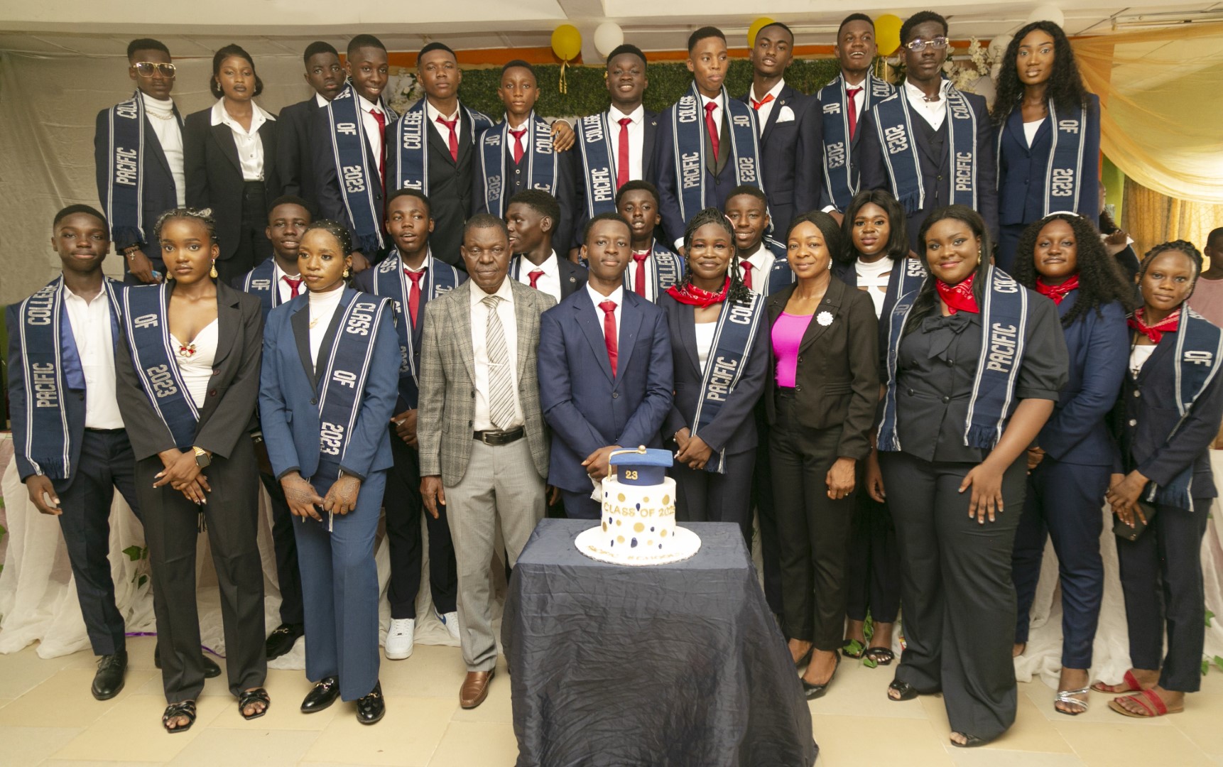 Class of 2023 with the school's chairman and principal.